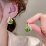 Elegant Simulated Pearl and Rhinestone Stud Earrings - Image 2