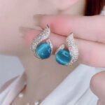 Elegant Simulated Pearl and Rhinestone Stud Earrings - Image 10