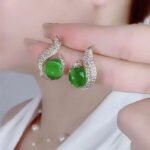 Elegant Simulated Pearl and Rhinestone Stud Earrings - Image 11